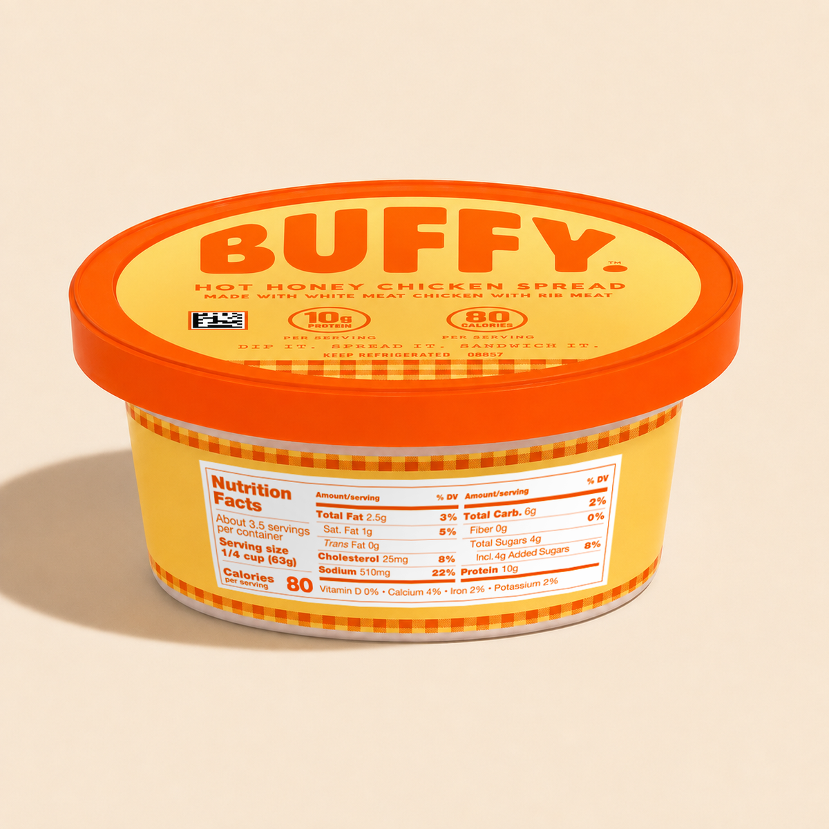A tub of BUFFY Hot Honey Chicken Spread with a bright orange lid and yellow label, shown on a warm beige background. The front label includes a Nutrition Facts panel and a gingham pattern near the bottom.